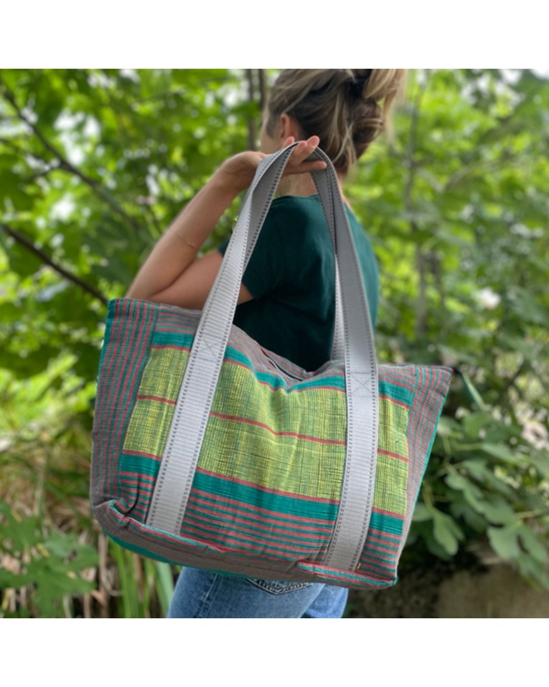 A perfect carry-on bag in semi waterproof material handwoven in burkina faso.