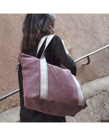 Travel bag in recycled material and organic hand woven cotton and dyes.